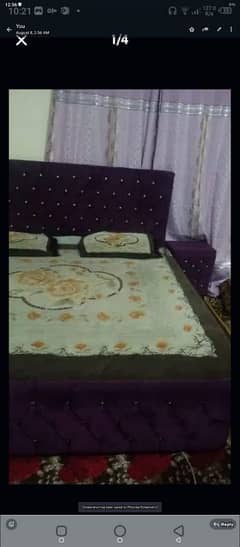 purple bed with 2 side tables