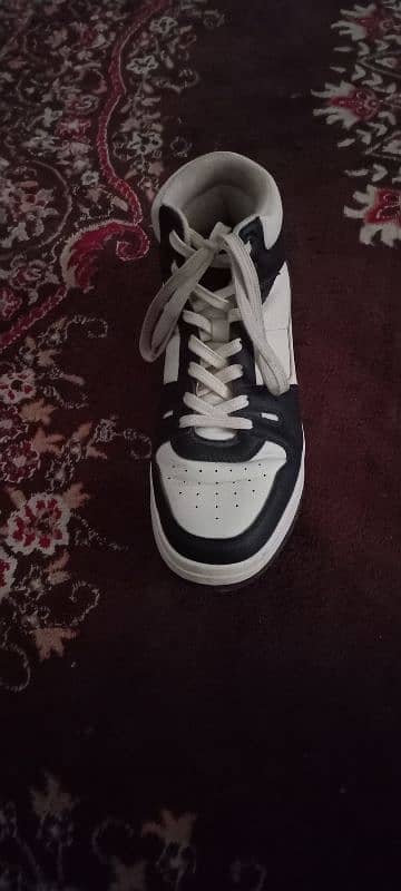 Black and white boots for sale. 1