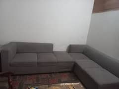 Lshaped sofa with table 0