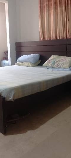 king size bed with two side tables and mattress