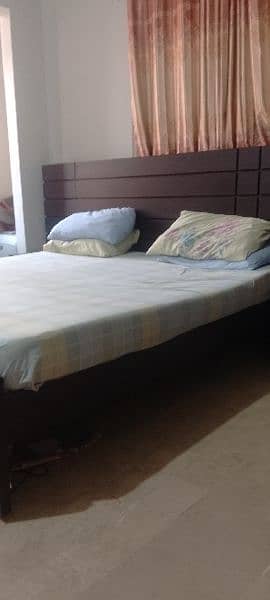 king size bed with two side tables and mattress 1