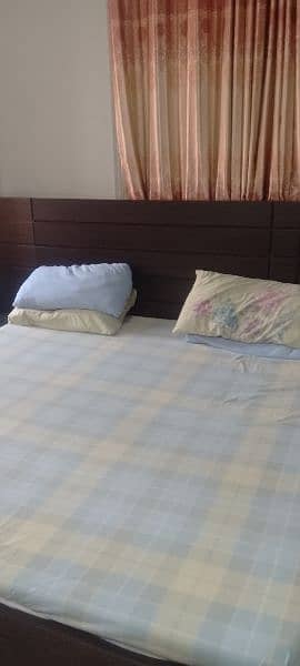 king size bed with two side tables and mattress 3