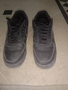 beat up pair of black air force 1s