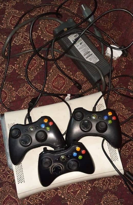 Xbox 360 with 3 controllers 27 games installed 0