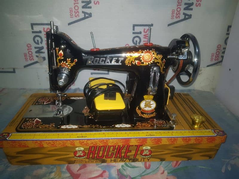 Rocket sewing machine with motor and handle. 1