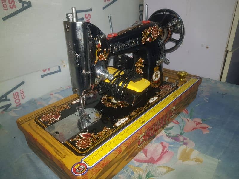 Rocket sewing machine with motor and handle. 2