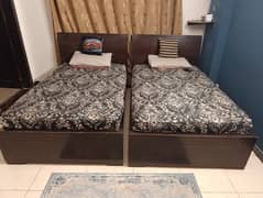 Two Single beds with siders and mattresses