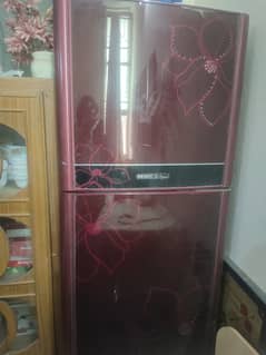 It's an orient fridge . Dark red in color 0