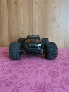 40 kilomter 4×4 rc car with strong suspinsion red color and very good.