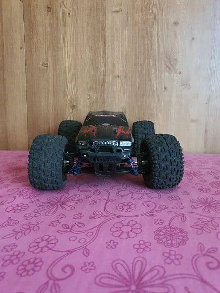 40 kilomter 4×4 rc car with strong suspinsion red color and very good. 0