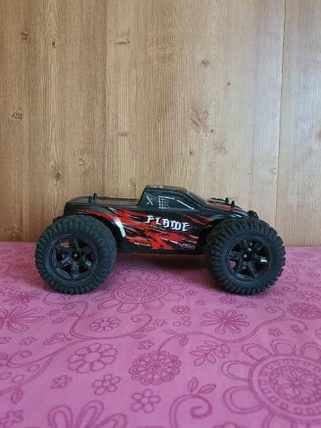 40 kilomter 4×4 rc car with strong suspinsion red color and very good. 1