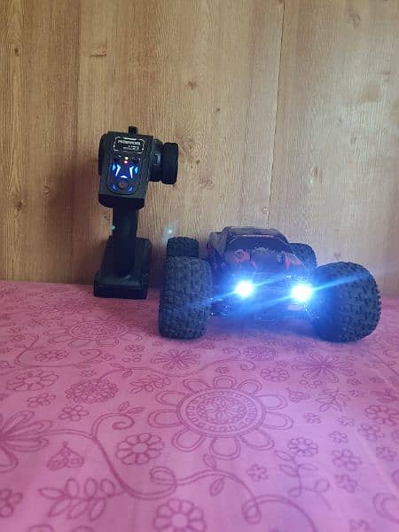 40 kilomter 4×4 rc car with strong suspinsion red color and very good. 9