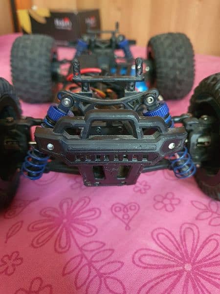 40 kilomter 4×4 rc car with strong suspinsion red color and very good. 11