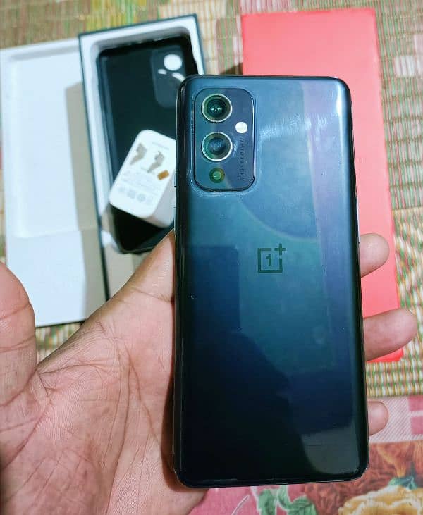 Oneplus 9 5g 12+12gb 256gb with all assesres offical pta pay tax 57k 1