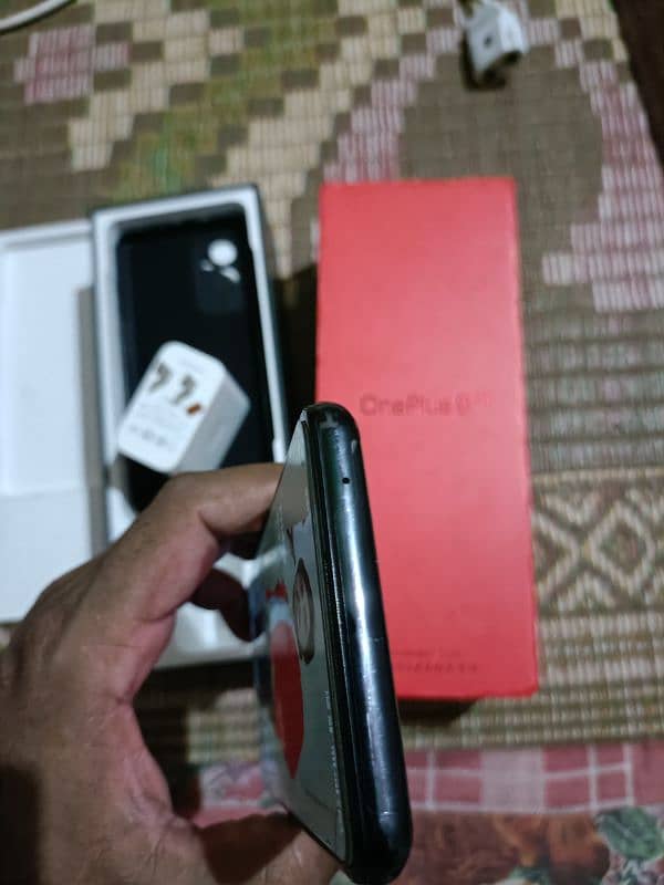 Oneplus 9 5g 12+12gb 256gb with all assesres offical pta pay tax 57k 4