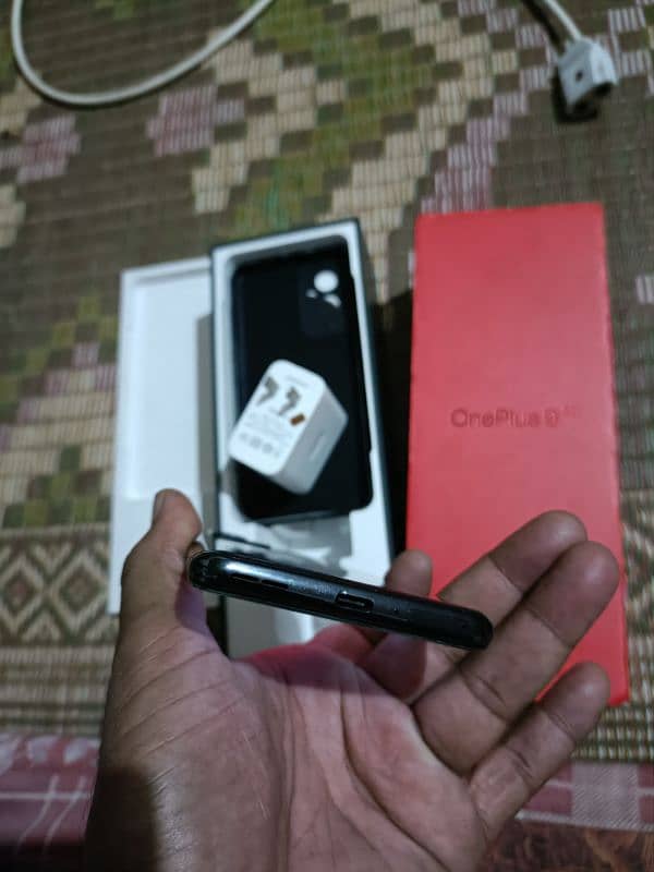 Oneplus 9 5g 12+12gb 256gb with all assesres offical pta pay tax 57k 5