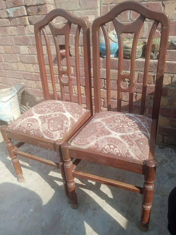 A dining table with 8 chairs 8