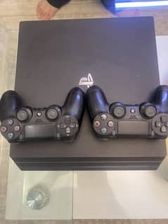 Used Sony PlayStation 4 Pro console and 2 controllers