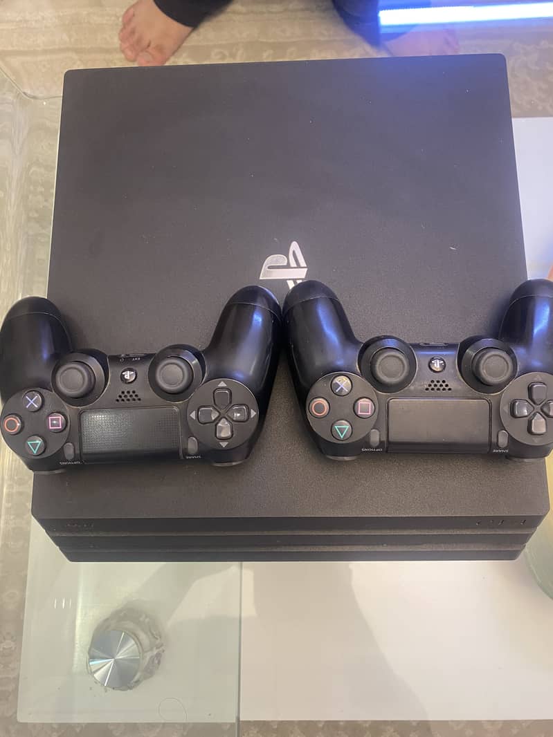 Used Sony PlayStation 4 Pro console and 2 controllers 0