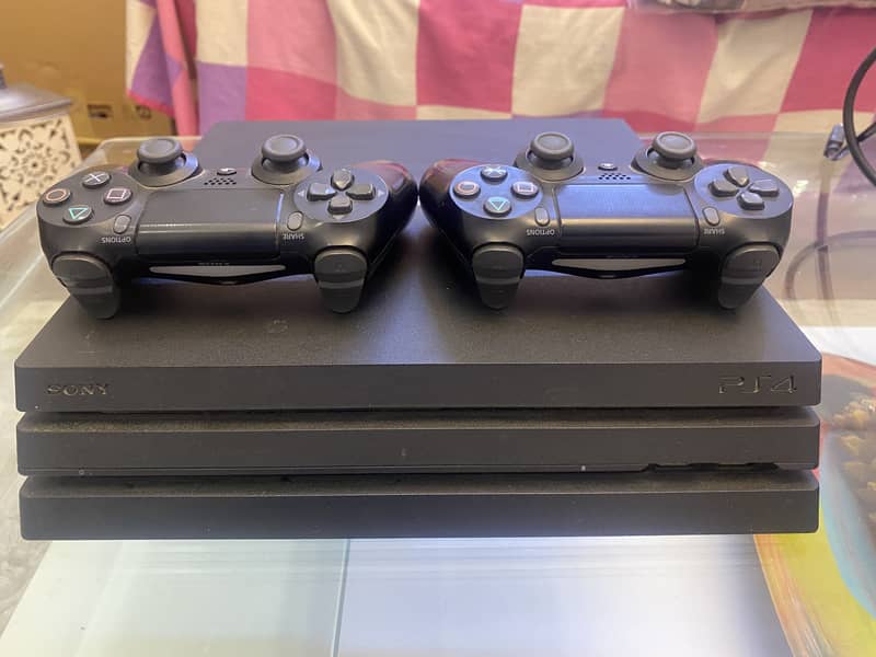 Used Sony PlayStation 4 Pro console and 2 controllers 1