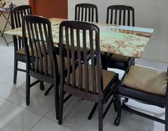 glass top dinning table with 6 wooden chairs