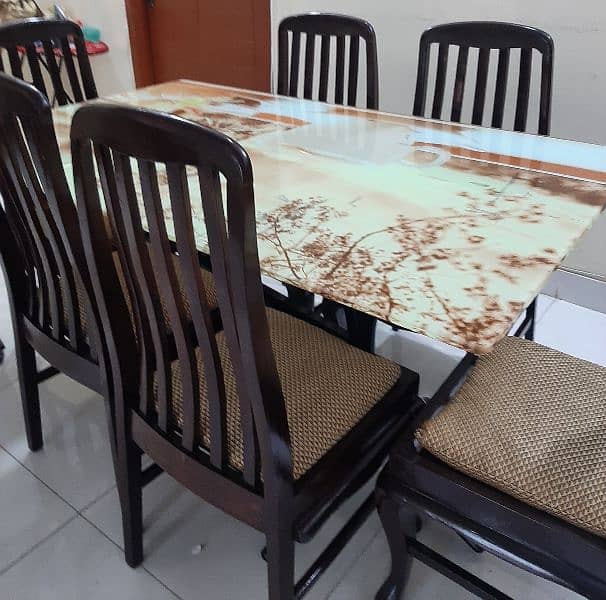 glass top dinning table with 6 wooden chairs 1