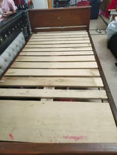 wooden bed with mattress