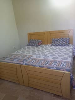 Wooden 2 single beds with mattresse