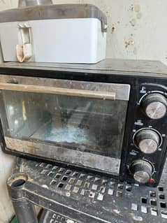 oven hai bilkul sahi working hain kahin se bhi kharab nhi hai sirfdust