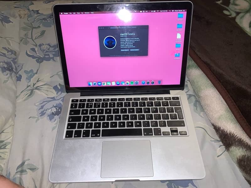 MacBook Pro mid 2014 model with charger and laptop sleeve 0