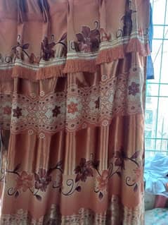 3 brown and 2 orange curtains