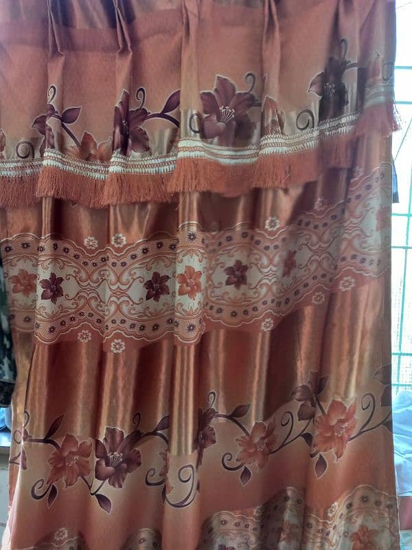 3 brown and 2 orange curtains 1