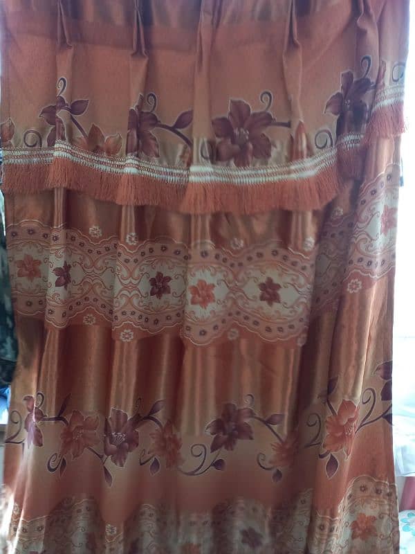 3 brown and 2 orange curtains 2