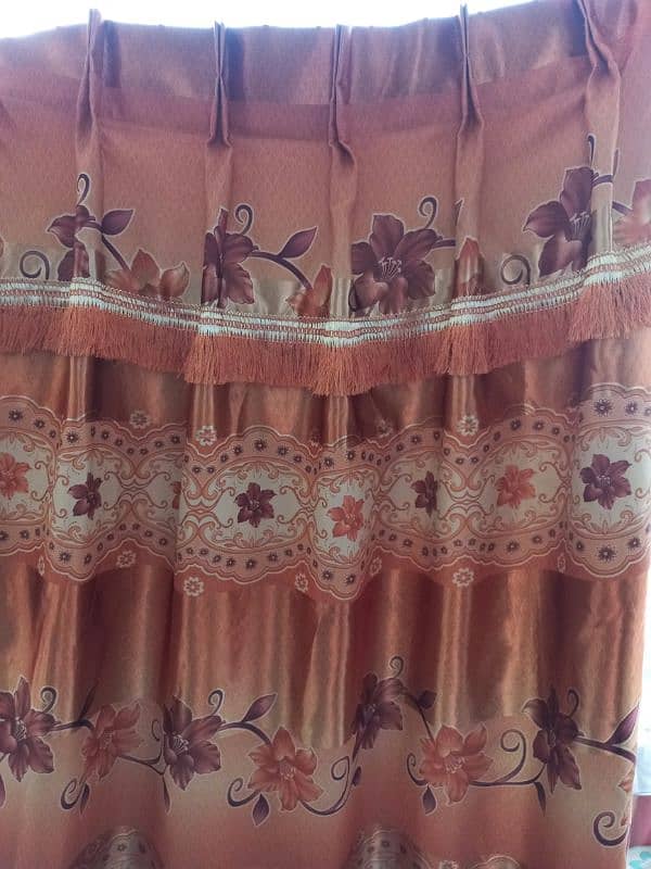 3 brown and 2 orange curtains 4