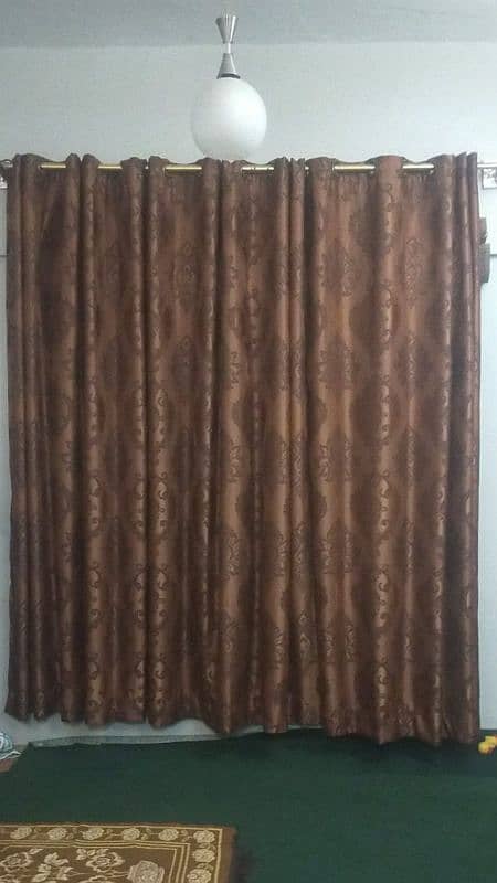 3 brown and 2 orange curtains 6