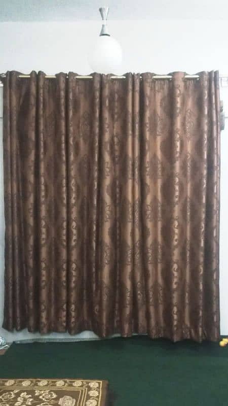 3 brown and 2 orange curtains 7