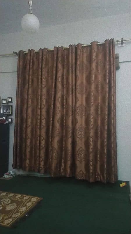 3 brown and 2 orange curtains 8