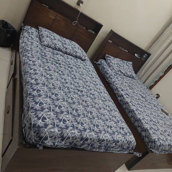 2 single bed  storege draw  metres and side table each 25 0