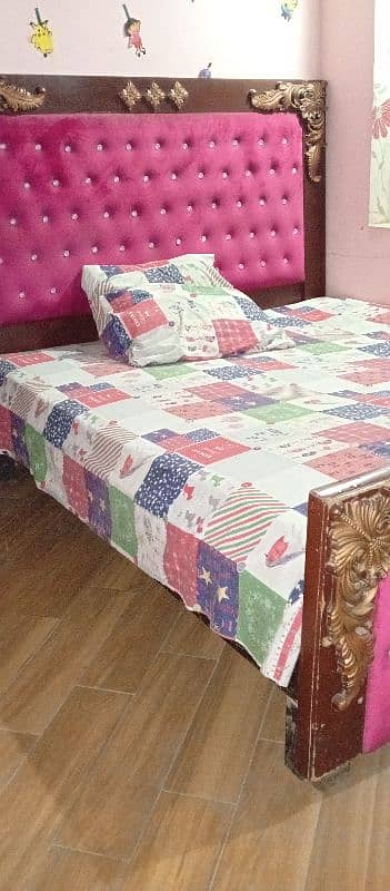 wooden double bed 0