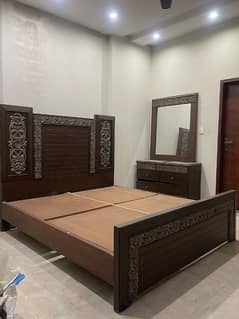 King bed with dressing table and a mattress