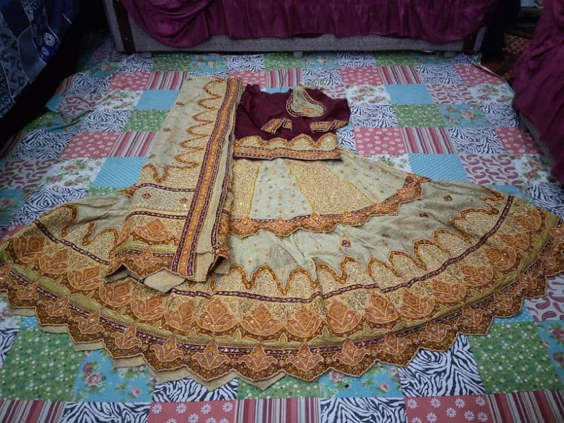 Bridal lehenga neat and clean maroon and Golden 0