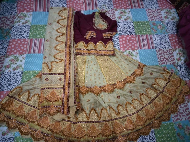 Bridal lehenga neat and clean maroon and Golden 1