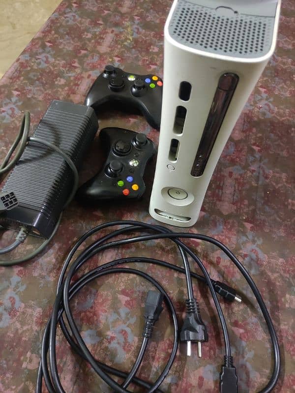 xbox 360, 2 wireless controllers, hdmi wire, power supply and 128 gb 1