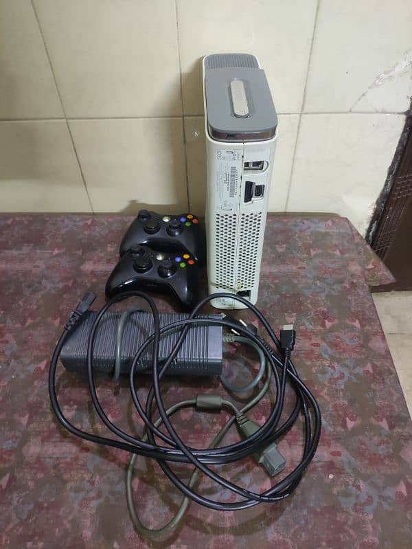 xbox 360, 2 wireless controllers, hdmi wire, power supply and 128 gb 6