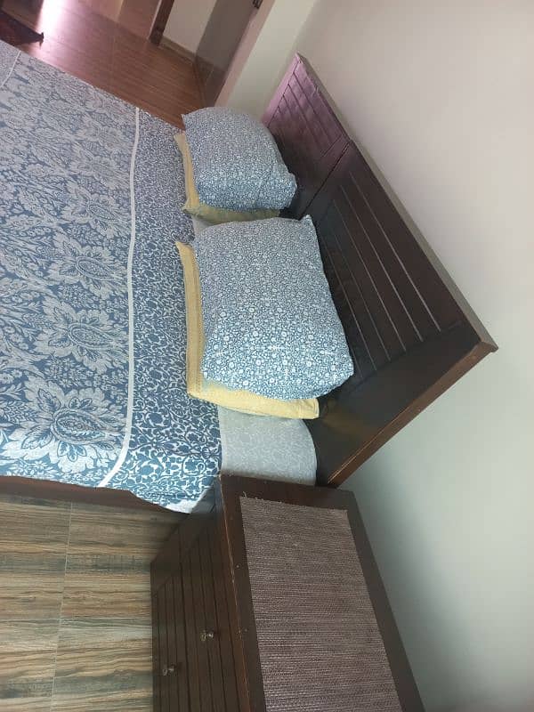 2 Single Beds and 1 side table. 4