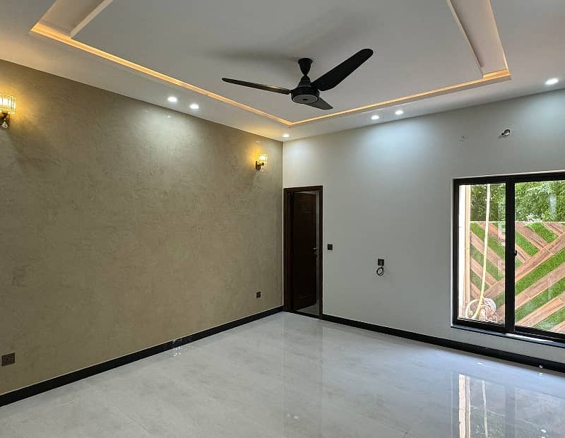 10 Marla Designer House Double Heighted Lobby is for Sale in Awais Qarni Block Bahria Town 5