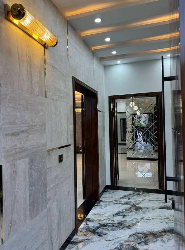 10 Marla Designer House Double Heighted Lobby is for Sale in Awais Qarni Block Bahria Town 12