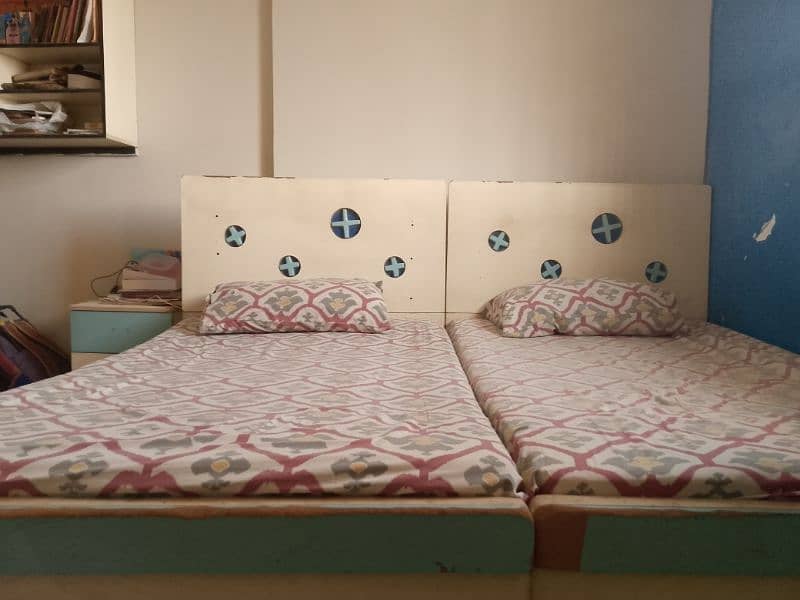 Two single beds use for sale with mattress 0