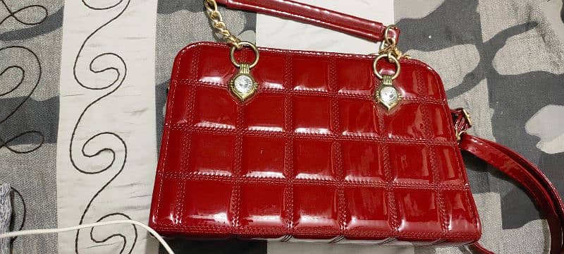 red shiny hand bag 1