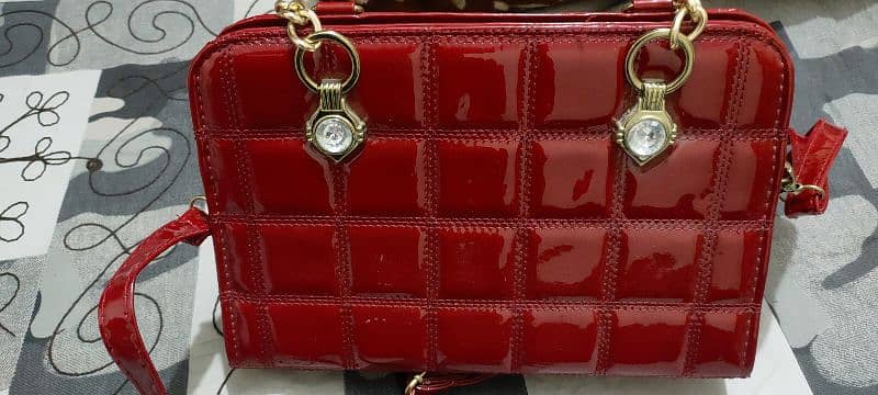 red shiny hand bag 2